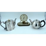 Two silver plate tea pots and a clock (3).