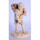 A 19TH CENTURY JAPANESE MEIJI PERIOD CARVED IVORY OKIMONO modelled as a roaming fisherman. 13.5 cm h