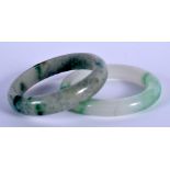 TWO CHINESE JADEITE BANGLES 20th Century. 8.5 cm diameter. (2)