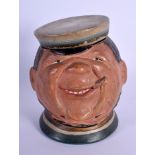 AN ANTIQUE AUSTRIAN TOBACCO JAR AND COVER in the form of John Nicholson. 15 cm high.