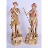 A LARGE PAIR OF ROYAL DUX PORCELAIN FIGURES modelled seated beside sheep and goats. 38 cm high.