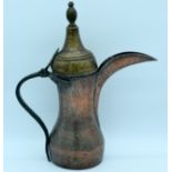 A Middle Eastern 19th Century copper ewer 43 cm.
