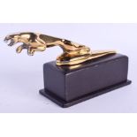 A GOLD PLATED JAGUAR CAR MASCOT. 17 cm wide.