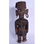 AN EARLY 20TH CENTURY AFRICAN COLONIAL CARVED WOOD TRIBAL FIGURE. 35 cm high.