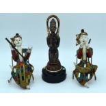 A vintage Japanese lighter and two wooden Thai figures 29cm . (3)