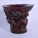 A CHINESE CARVED BUFFALO HORN LIBATION CUP 20th Century. 11 cm x 11 cm.