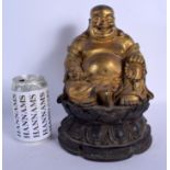 A CHINESE GILT BRONZE FIGURE OF A SEATED BUDDHA 20th Century, modelled upon a lotus base. 26 cm x 12