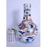 A 19TH CENTURY CHINESE BLUE AND WHITE IRON RED VASE Daoguang mark and probably of the period. 32 cm