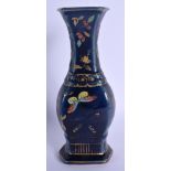 AN 18TH/19TH CENTURY CHINESE POWDER BLUE PORCELAIN VASE Qianlong/Jiaqing, enamelled with butterflies