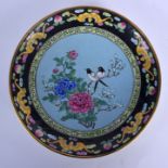 AN EARLY 20TH CENTURY CHINESE CANTON ENAMEL CIRCULAR DISH Late Qing, painted with magpie amongst fol