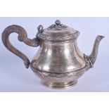 A 19TH CENTURY FRENCH SILVER TEAPOT embossed with foliage. 640 grams. 13 cm x 21 cm.