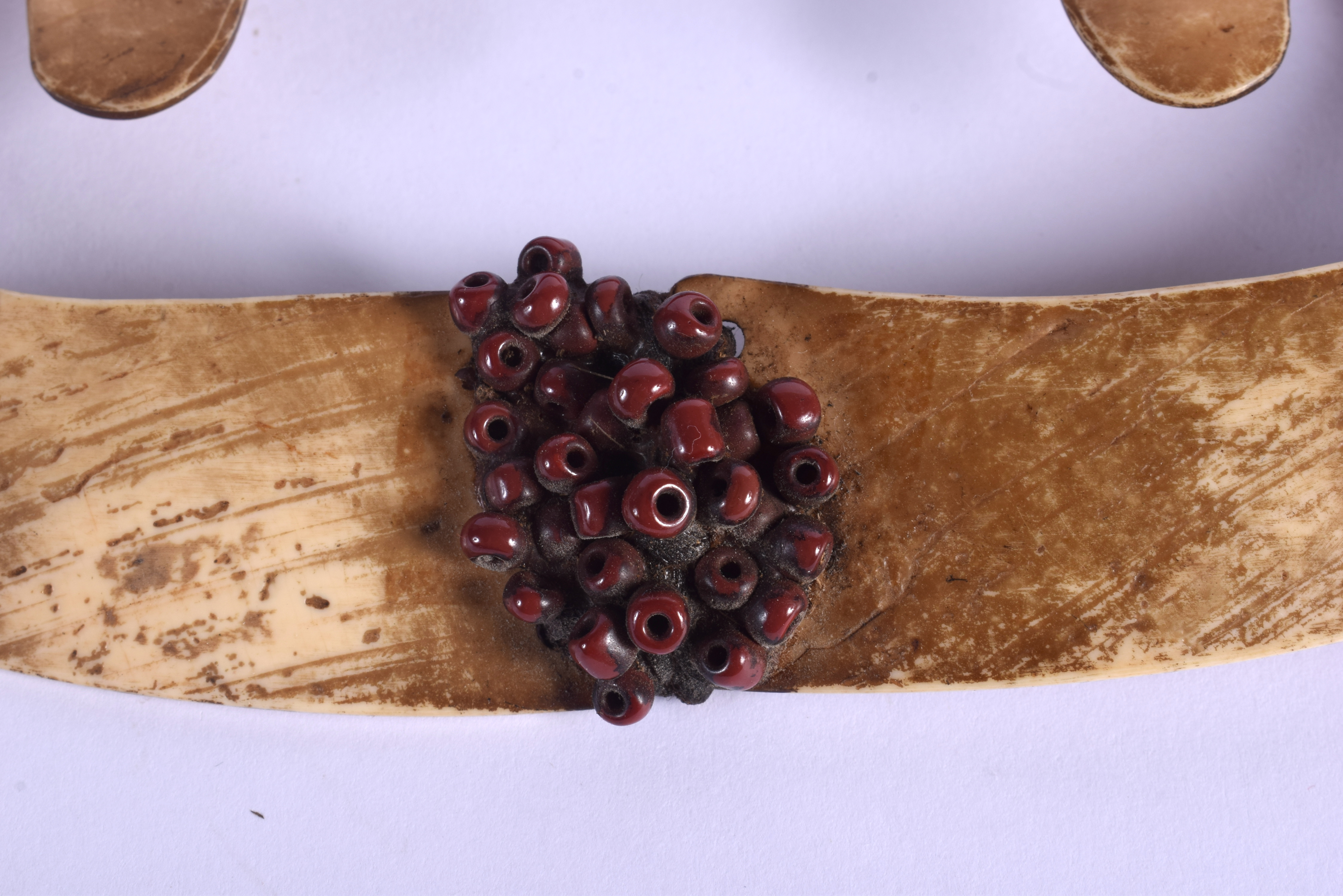 A TRIBAL PAPUA NEW GUINEA CARVED SHELL NOSE ORNAMENT. 16 cm x 7 cm. - Image 4 of 5