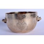 A 19TH CENTURY INDO TIBETAN TWIN HANDLED POLISHED BRASS CENSER with carved rhinoceros horn handles,