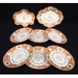 A set of early 19th century Worcester plates and dishes painted with orange floral pattern largest 2