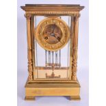 A 19TH CENTURY FRENCH BRONZE FOUR GLASS REGULATOR MANTEL CLOCK with column supports and circular dia