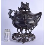 A VERY LARGE 18TH/19TH CENTURY CHINESE BRONZE PEACH FORM COVERED CENSER Qing, upon a naturalistic br