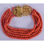 A LONG 18CT GOLD AND CORAL NECKLACE. 240 grams. 30 cm long.