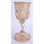 A 19TH CENTURY BOHEMIAN GILT PAINTED GLASS BEAKER CUP painted with motifs. 19 cm high.