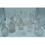 A collection of glass decanters (16).