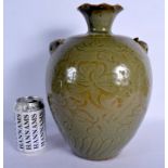 A LARGE 19TH CENTURY CHINESE CELADON BULBOUS VASE Qing, engraved with foliage and vines. 33 cm high.