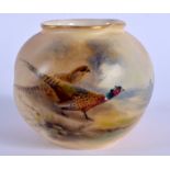 A ROYAL WORCESTER VASE painted with a brace of pheasants by Jas Stinton, signed, shape G161,date cod