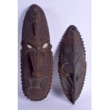 TWO PAPUA NEW GUINEA TRIBAL MASKS. Largest 47 cm x 16 cm. (2)