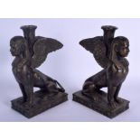 A PAIR OF CONTINENTAL BRONZE GRAND TOUR INSPIRED SPHINX CANDLESTICKS. 28 cm x 19 cm.