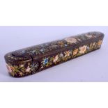 A 19TH CENTURY PERSIAN QAJAR LACQUER SLIDING PEN BOX painted with birds and flowers. 21 cm wide.