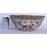 A LARGE 19TH CENTURY CHINESE CANTON FAMILLE ROSE PORCELAIN BOWL Qing, painted with figures within in