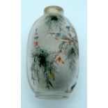 A reverse painted snuff bottle birds in foliage 7 x 4 cm.