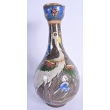 A MIDDLE EASTERN PERSIAN POTTERY VASE painted with a bird. 30 cm high.