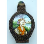 A metal snuff bottle with an enamelled painted picture of a woman 8 x 5cm.