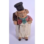 AN ANTIQUE AUSTRIAN TOBACCO JAR AND COVER in the form of a pig holding sausages. 22 cm high.