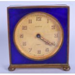 AN ART DECO GERMAN ENAMELLED EIGHT DAY DESK CLOCK. 8 cm x 6 cm.