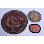 THREE EARLY 20TH CENTURY CHINESE SILK PANELS. Largest 18 cm diameter. (3)