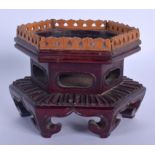 A LATE 19TH CENTURY CHINESE HARDWOOD AND SANDALWOOD STAND Qing, of hexagonal form. 11 cm x 9 cm.