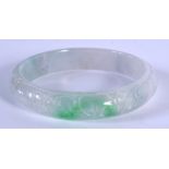 A CHINESE CARVED AGATE BANGLE 20th Century. 6.75 cm diameter.