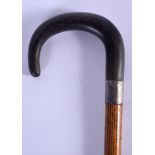 A 19TH CENTURY CONTINENTAL CARVED RHINOCEROS HORN HANDLED WALKING CANE. 80 cm long.