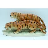 A German porcelain figure of two tigers 43 x 18cm.