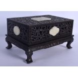 AN EARLY 20TH CENTURY CHINESE CARVED HARDWOOD AND JADE BOX AND COVER Late Qing, possibly zitan, carv