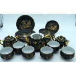A Japanese Taisho period egg shell tea set painted with landscapes. (qty)