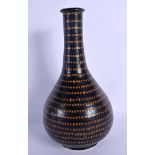 A CHINESE STONEWARE BULBOUS VASE 20th Century, painted with brown dimples .29 cm high.