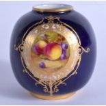 A ROYAL WORCESTER VASE painted with painted with fruit in a gilt panel on a blue ground date code fo