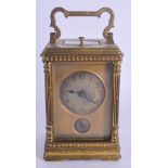 A 19TH CENTURY FRENCH BRASS REPEATING CARRIAGE CLOCK with fan form dial. 14.5 cm high inc handle.