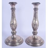 A LARGE PAIR OF 19TH CENTURY CONTINENTAL SILVER CANDLESTICKS decorated with foliage. 637 grams. 31 c