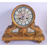 AN UNUSUAL 19TH CENTURY FRENCH GILT BRONZE SEVRES PORCELAIN MANTEL CLOCK with lion mask head mounts.