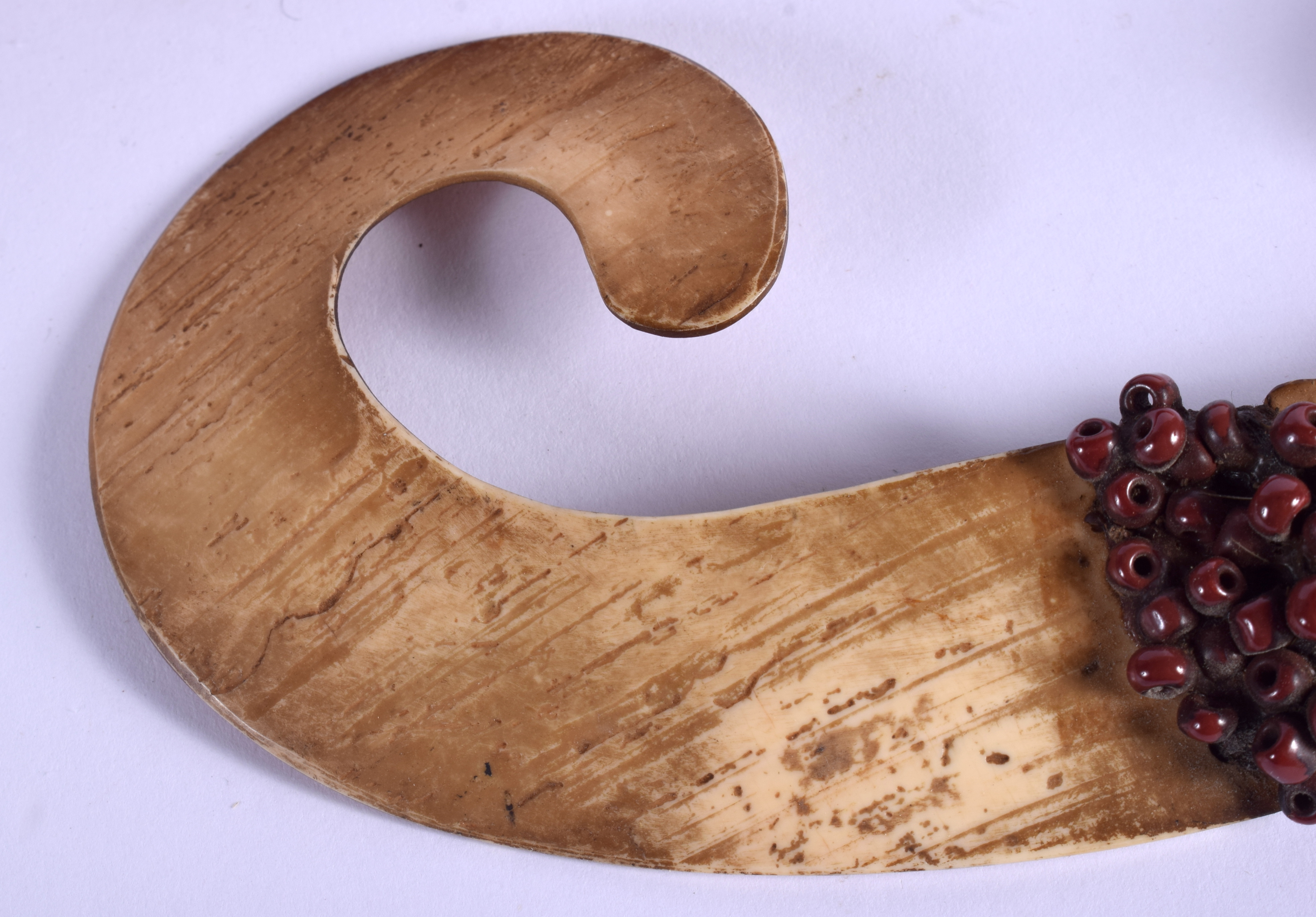 A TRIBAL PAPUA NEW GUINEA CARVED SHELL NOSE ORNAMENT. 16 cm x 7 cm. - Image 5 of 5