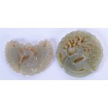 TWO EARLY 20TH CENTURY CHINESE CARVED JADE PLAQUES Late Qing. 5 cm diameter. (2)