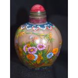 A Chinese glass snuff bottle decorated with insects and foliage 7 cm .