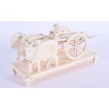 A 19TH CENTURY ANGLO INDIAN CARVED IVORY OXEN CART modelled with attendant. 13 cm x 7 cm.